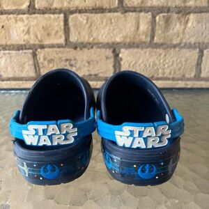 CROCS Blue and Black Slippers with Space-Themed Design